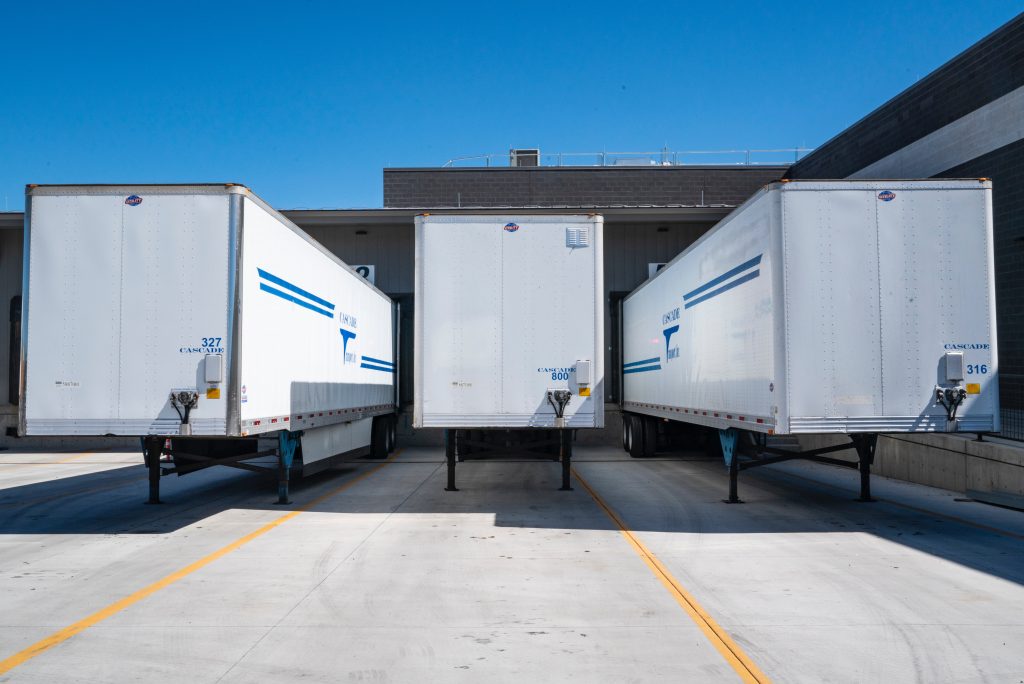 Trucks being unloaded (Logistics 101)
