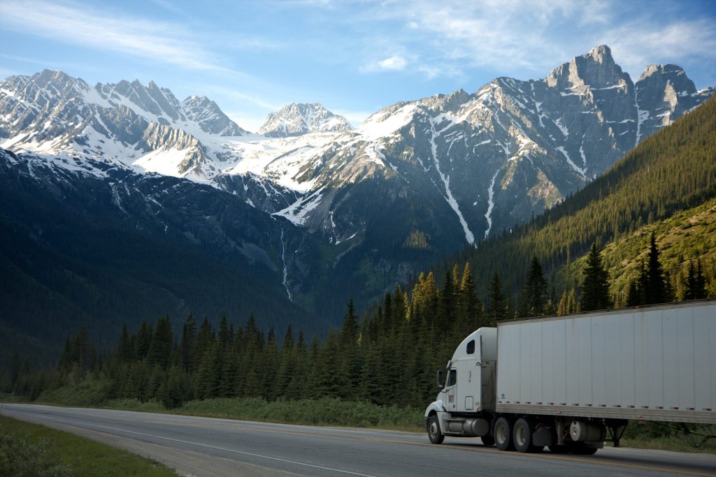 Truck driving in a mountain range (Logistics 101)